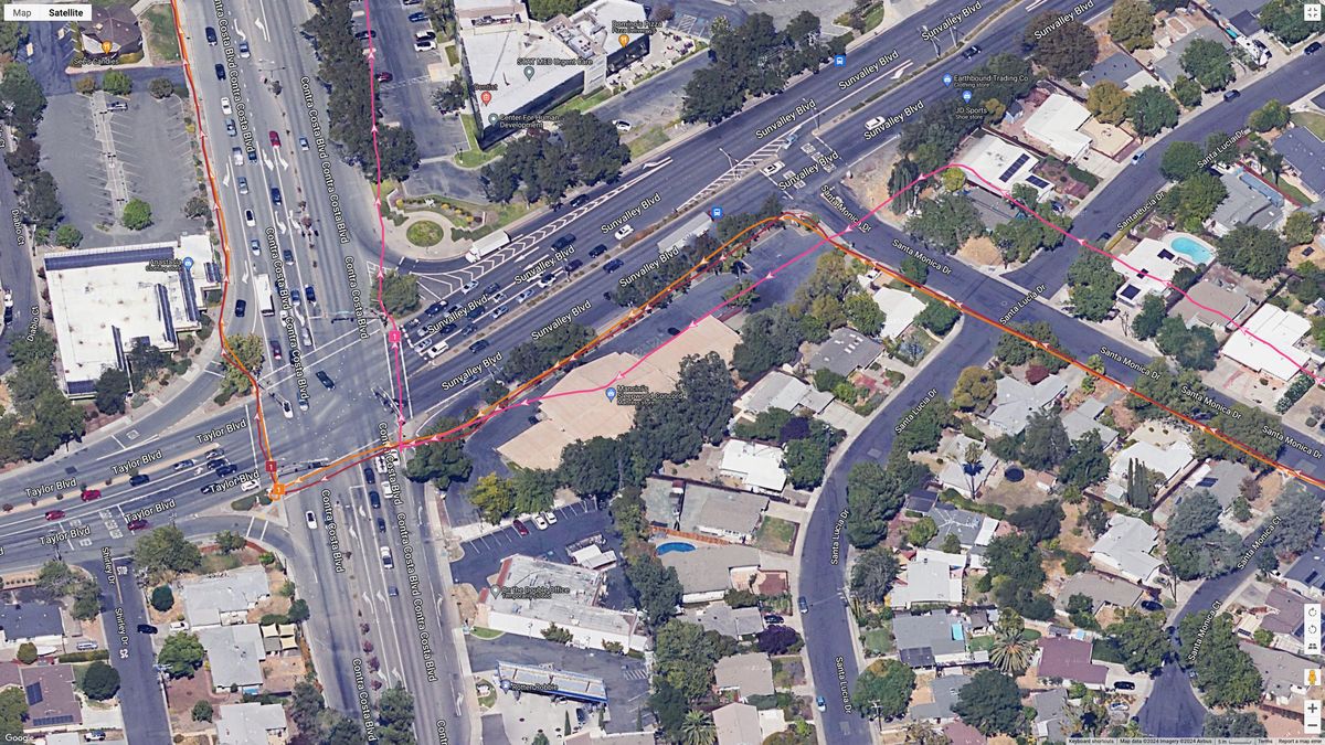 A GPS map showing how the COROS VERTIX 2S (orange line), Garmin Forerunner 965 (brown line), and Polar Vantage V3 (pink line) performed.