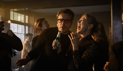 Nicola Walker and Jemaine Clement singing into a beer bottle in Alice and Steve.