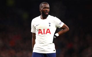 Tottenham Hotspur Tanguy Ndombele, standing with one hand on his hip