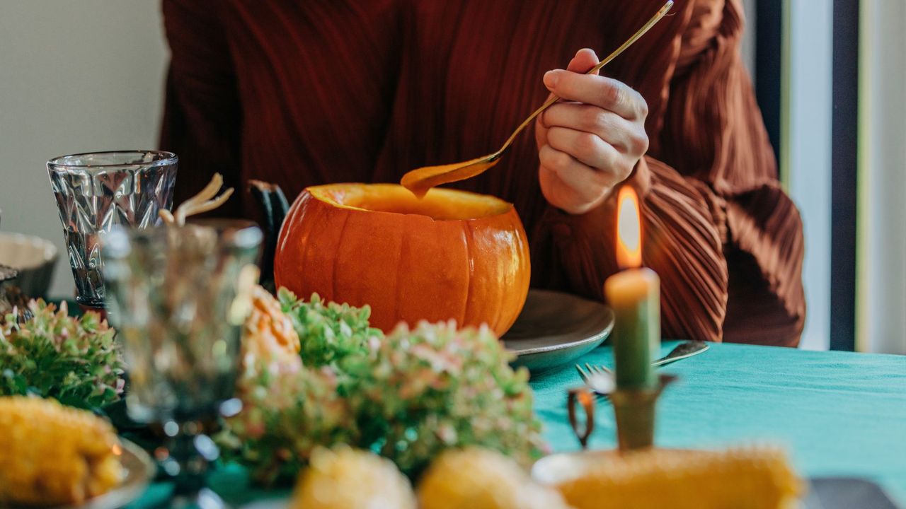 A woman eating one of the autumn foods that cause bloating