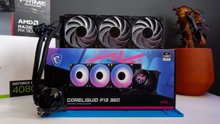 An MSI MPG CoreLiquid P13 all-in-one liquid cooler on a desk and installed onto a test bench for testing.
