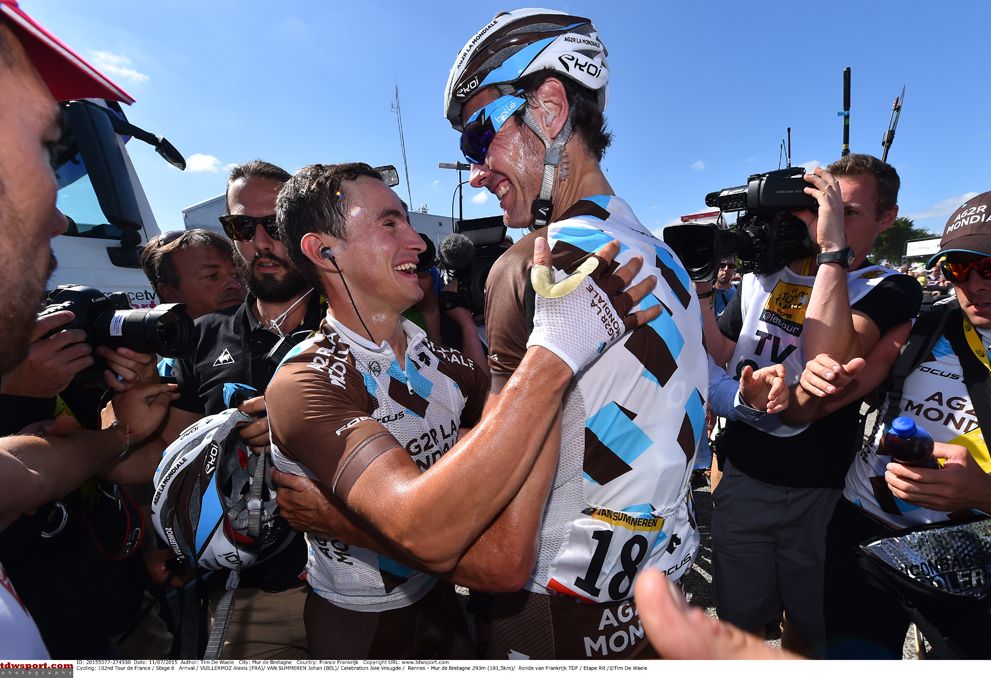 Alexis Vuillermoz and Johan Vansummeren embrace after the Frenchman won stage 8 at the Tour de France