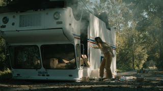 Kaitlyn Dever inspects a flipped mail truck in No One Will Save You