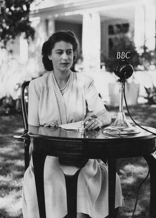 Princess Elizabeth makes a broadcast from the gardens of Government House in Cape Town, South Africa, on the occasion of her 21st birthday, 21st April 1947. In it, she pledged her service to the British Commonwealth and Empire.
