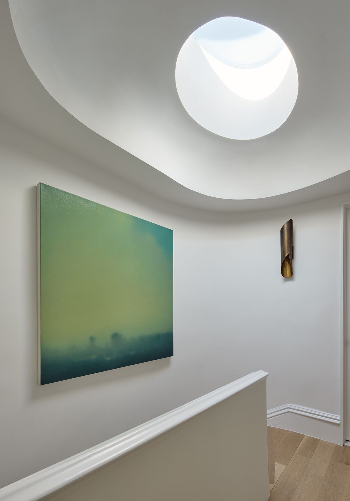 curved staircase and skylight in New York townhouse