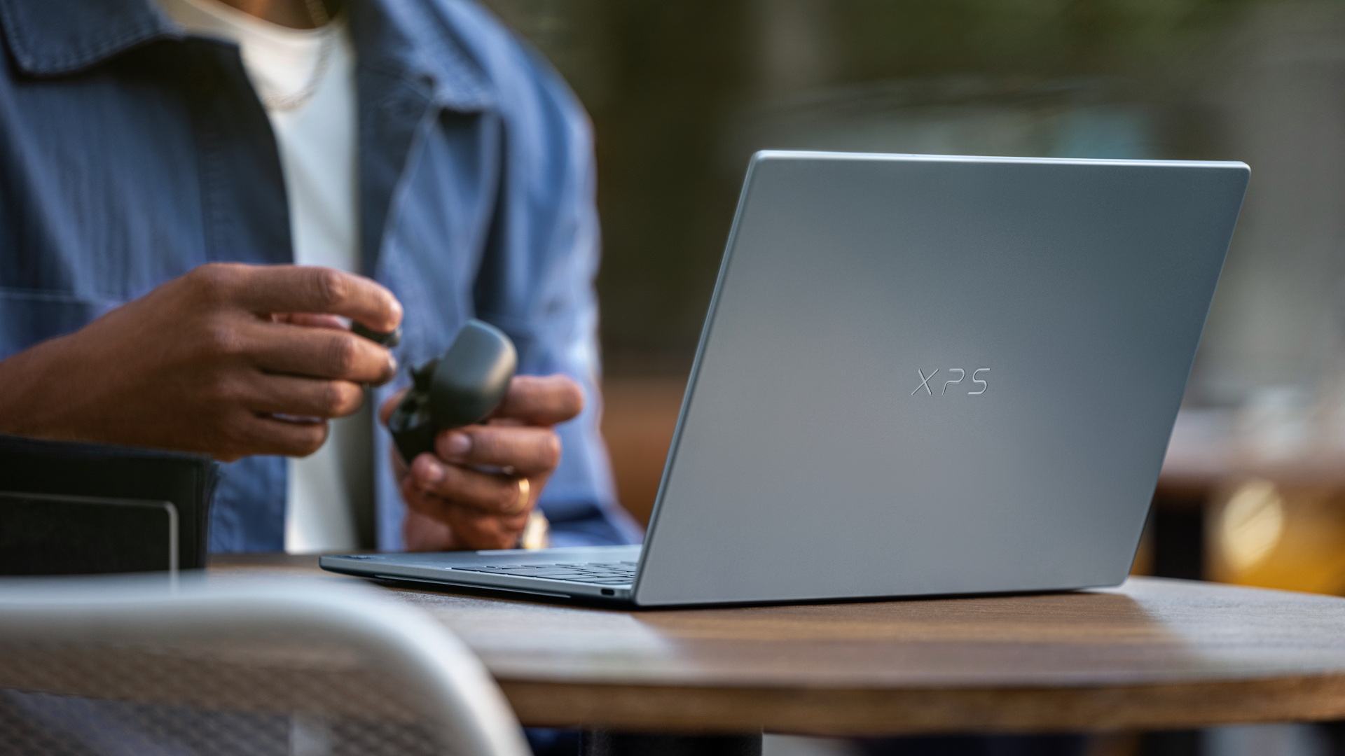Dell XPS 13 on a desk, at an angle from the rear