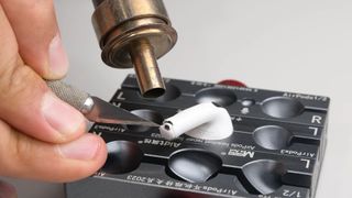 An iFixit teardown of the Apple AirPods 5 earphones.