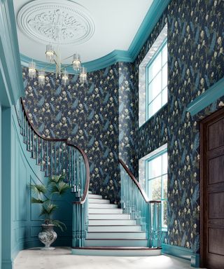 Teal and navy hallway with floral wallpaper and paint design