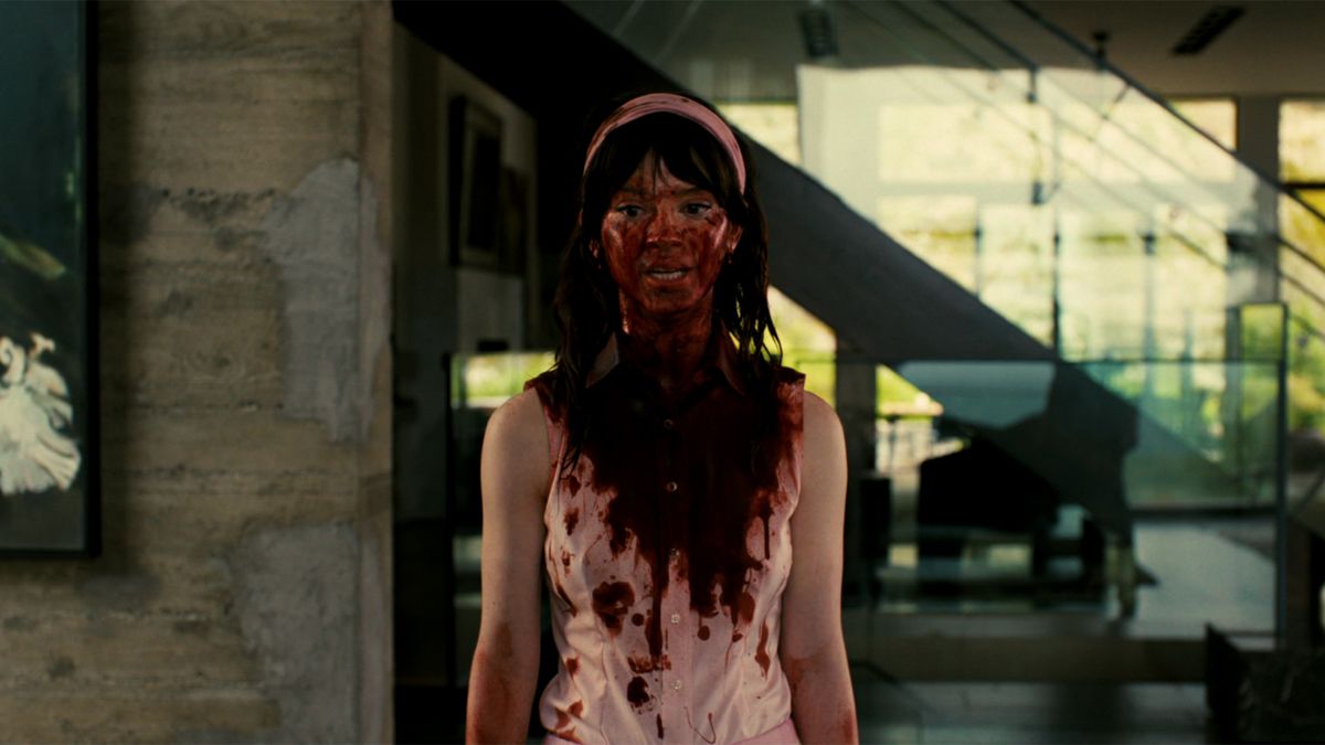 Sophie Thatcher as Iris covered in blood in Companion