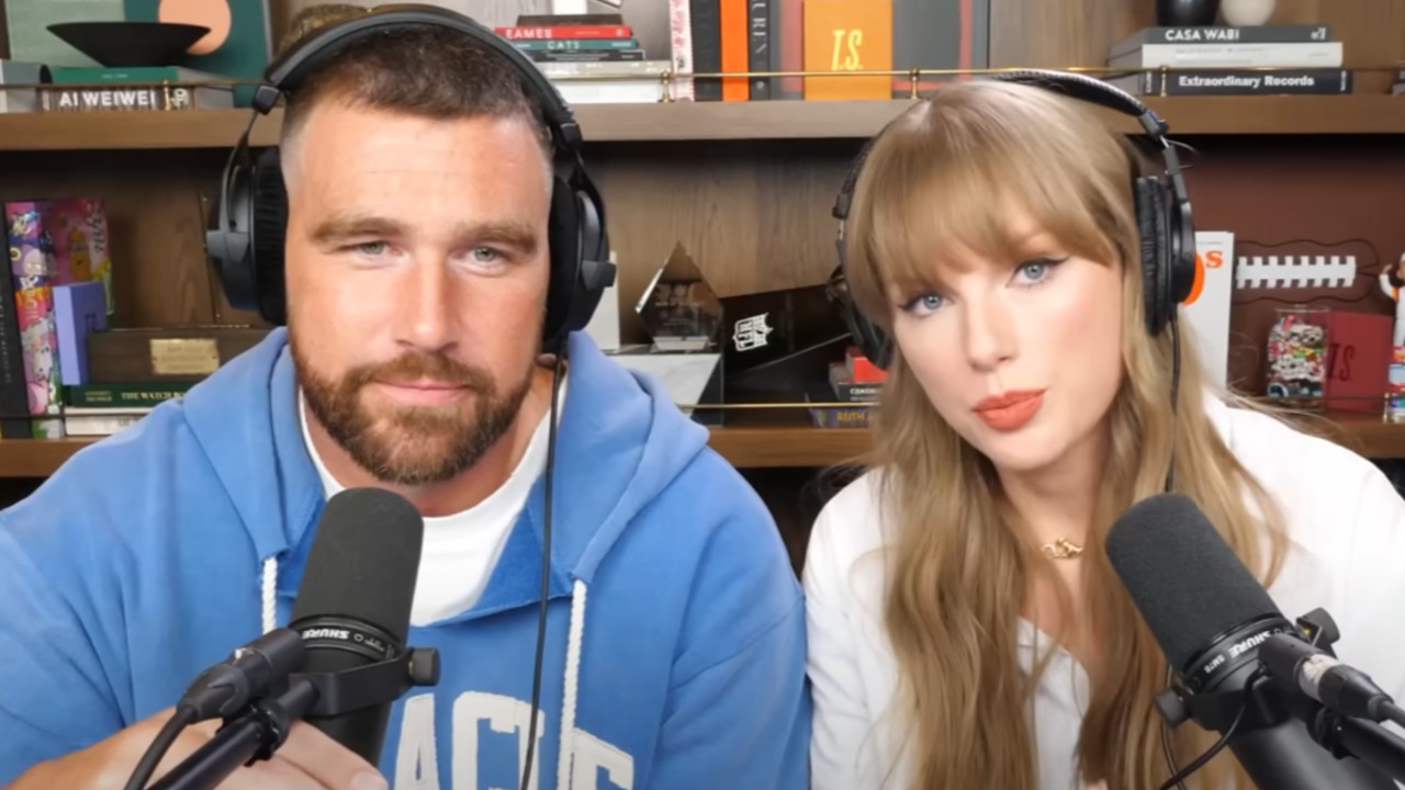 From left to right: Travis Kelce almost smiling and Taylor Swift talking next to him. 