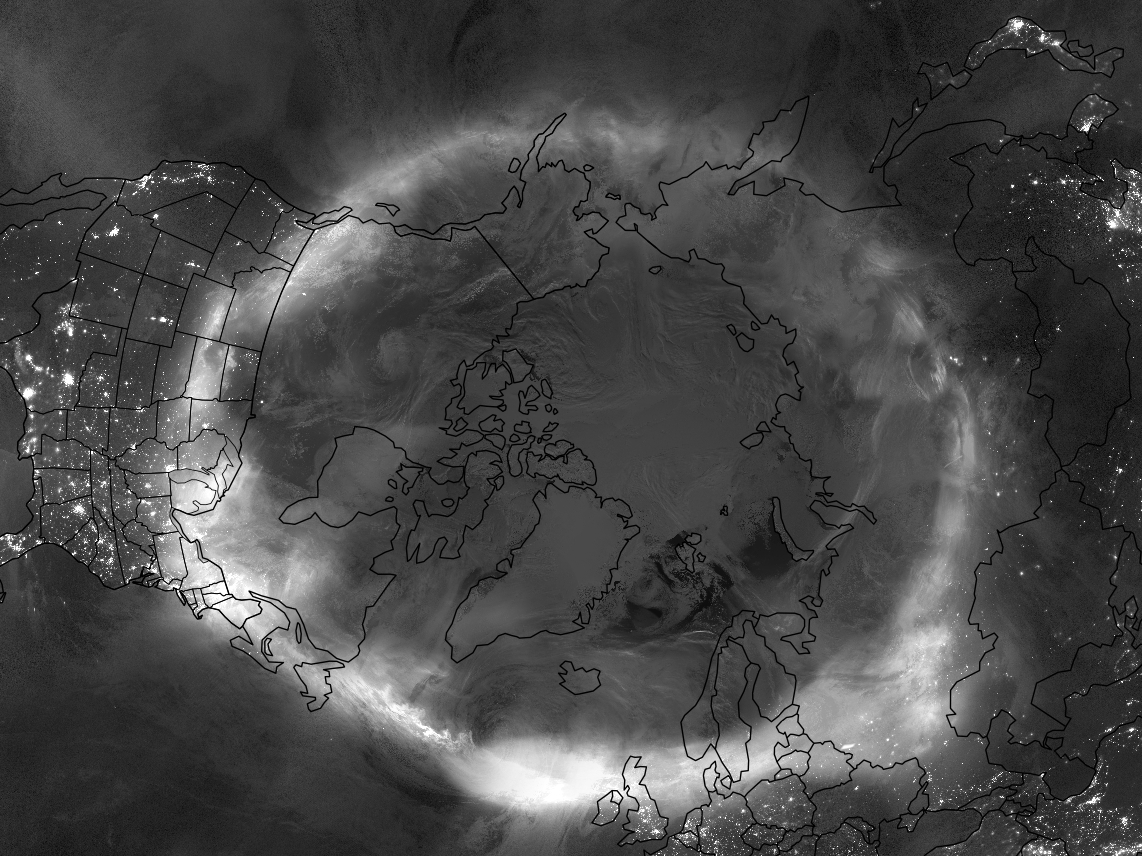 grey scale image over the northern hemisphere, showing a white wispy circle of aurora.