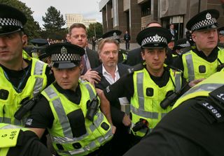 Craig Whyte, centre, leaves Glasgow Sheriff Court after he appeared as part of a Police Scotland investigation into Rangers