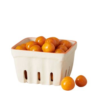 Cherry tomatoes in a white, ceramic food basket