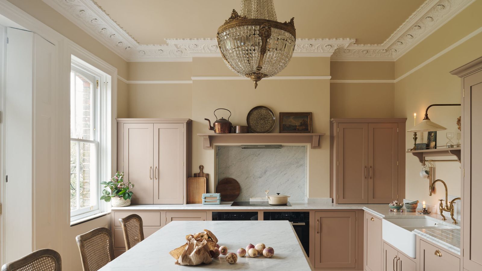 deVOL Kitchens French chic country kitchen with marble cooktop nook and chandelier