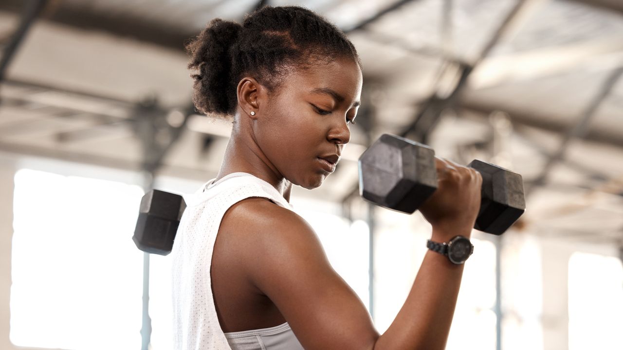 Woman exercising with dumbbells