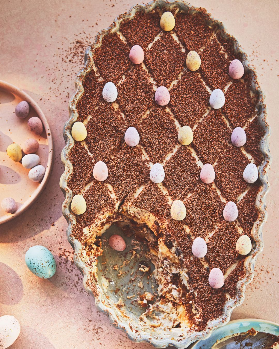Egg shaped tiramisu with mini eggs to decorate