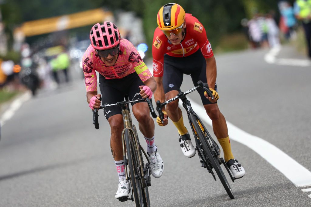 EF Education - EasyPost team's Ecuadorian rider Richard Carapaz (L) and Uno-X Mobility team's Norwegian rider Tobias Halland Johannessen (R) cycle ahead of the pack of riders (peloton) during the 13th stage of the 111th edition of the Tour de France cycling race, 165,3 km between Agen and Pau, southwestern France, on July 12, 2024. (Photo by Anne-Christine POUJOULAT / AFP)