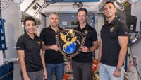 The four members of NASA’s SpaceX Crew-13 mission to the International Space Station display their mission plaque inside a training mockup of a space station module. From left: Commander Jessica Watkins and Pilot Luke Delaney, both from NASA, and Mission Specialists Joshua Kutryk of the Canadian Space Agency and Sergey Teteryatnikov of Roscosmos.