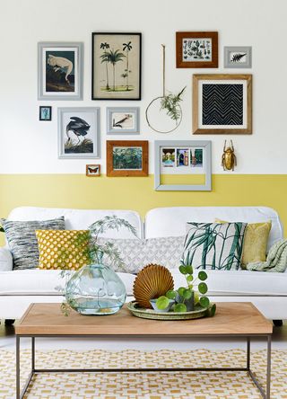 neutral and yellow living room with a personalised gallery wall to show interior design tips to help with seasonal affective disorder