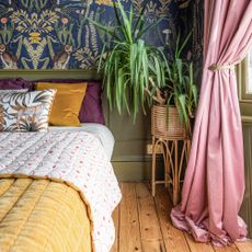 Green and pink bedroom with tropical wallpaper and panelling