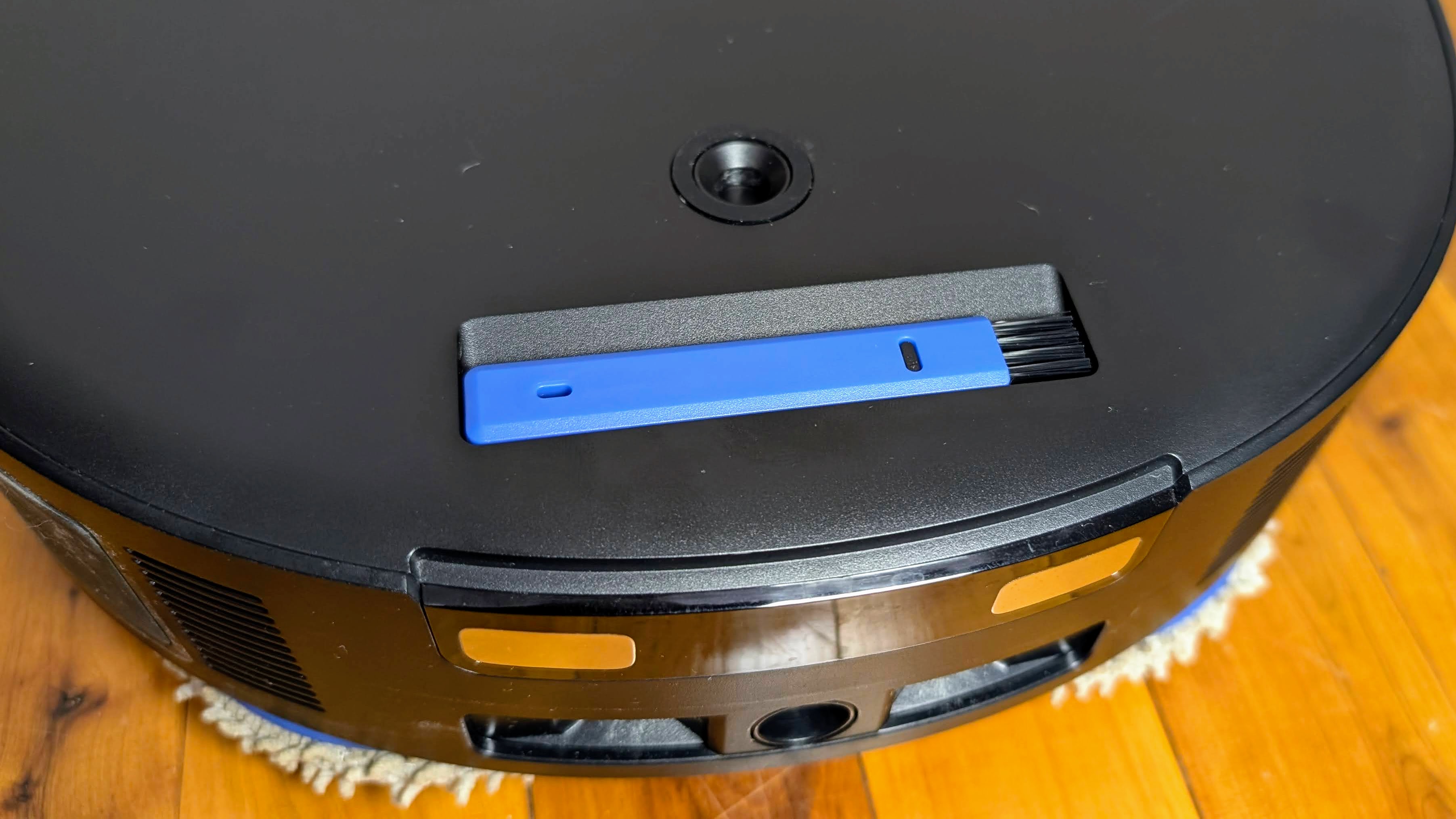 Ecovacs X5 Pro Omni with cover removed, showing cleaning brush