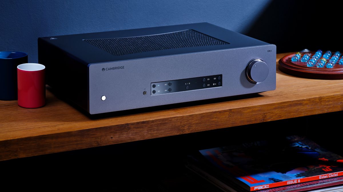 Cambridge Audio CXA81 Mk II in moody lifestyle setting on wooden shelf