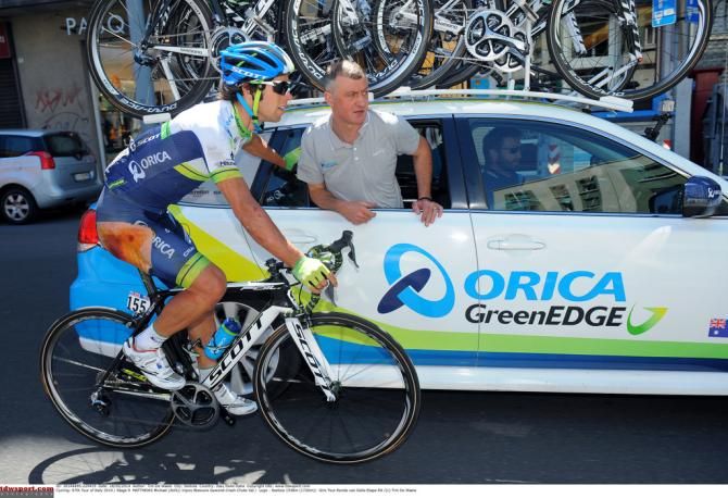 Michael Matthews (Orica-GreenEdge) with the team car