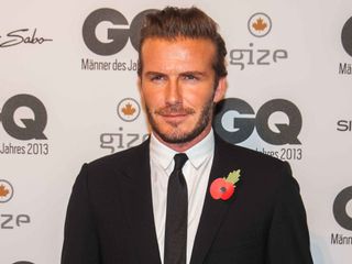 David Beckham smouldering in a sharp black suit at the GQ Awards 2013