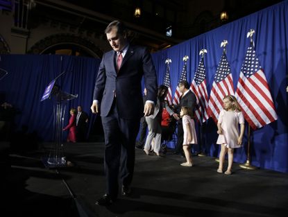 Ted Cruz walks off stage at a campaign event