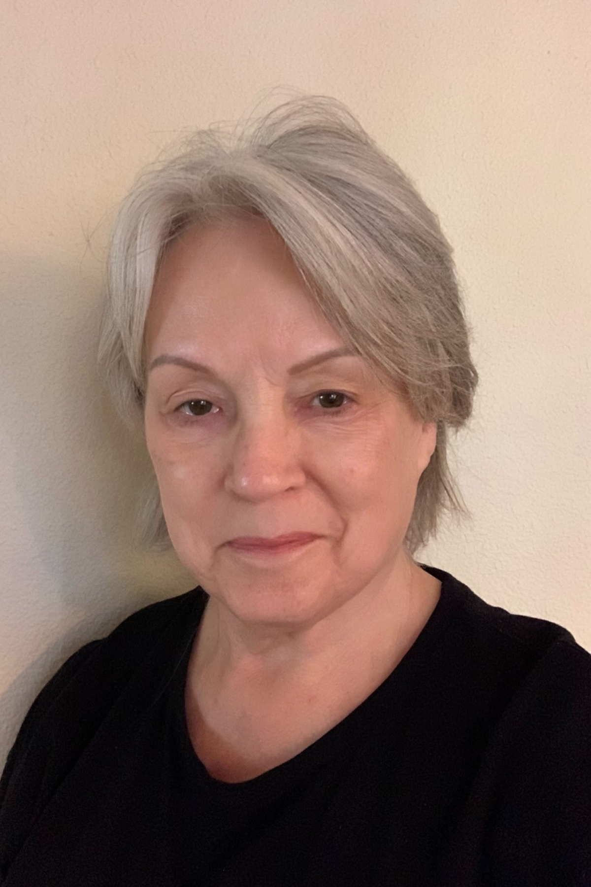 Jackie Witherow before applying Chanel Ultra Le Teint Ultrawear All Day Comfort Flawless Finish Foundation to her face with a black sweater.