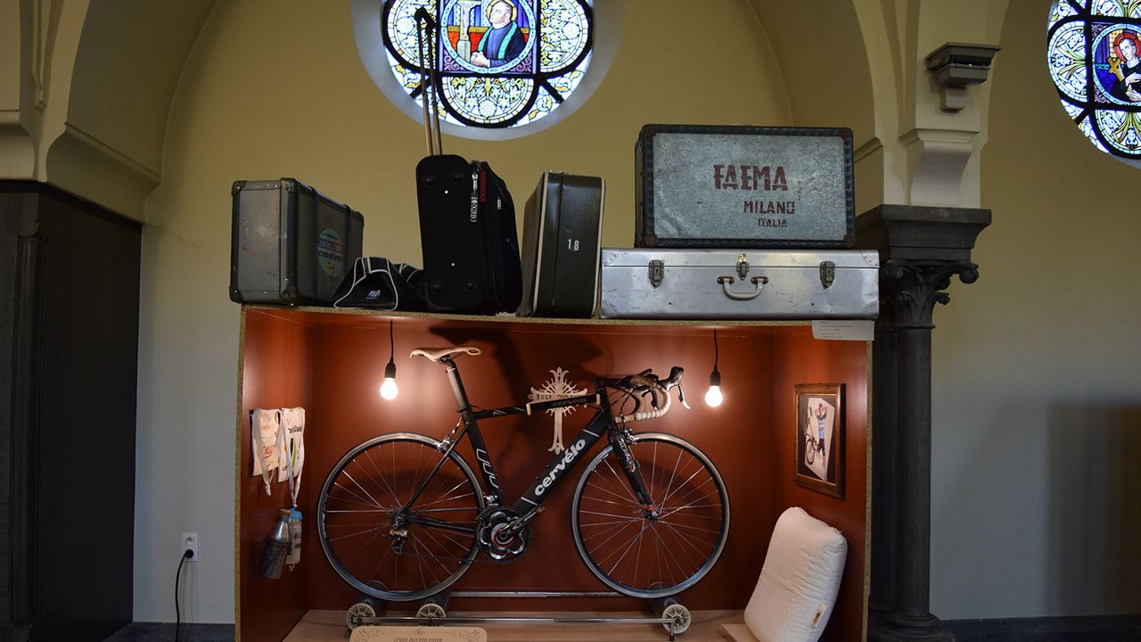 This display showcases professional cyclists living like monks with little posessions while on the road