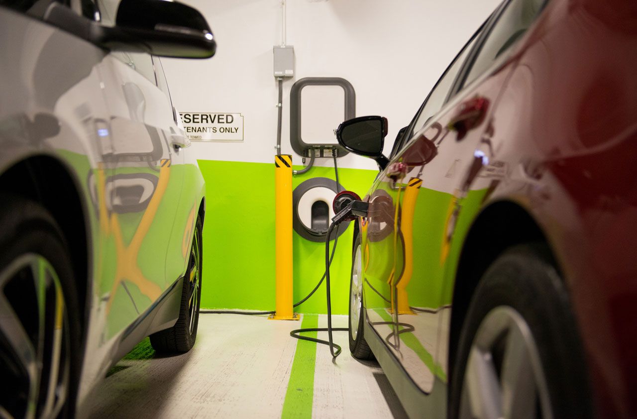 electric car plugged in to charger