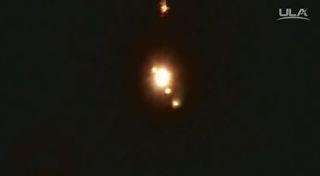 Four solid rocket boosters (smaller lights) can be seen just after separating from the ULA Delta IV rocket carrying the WGS-9 military communications satellite during the March 18, 2017 launch.