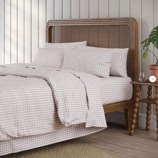 Mushroom Gingham Bedding Bundle on a bed against a white wall. 