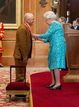 John Hurt is knighted by the Queen