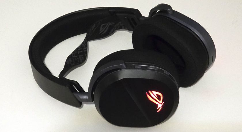 The Asus ROG Pelta gaming headset lying on a table with the microphone removed