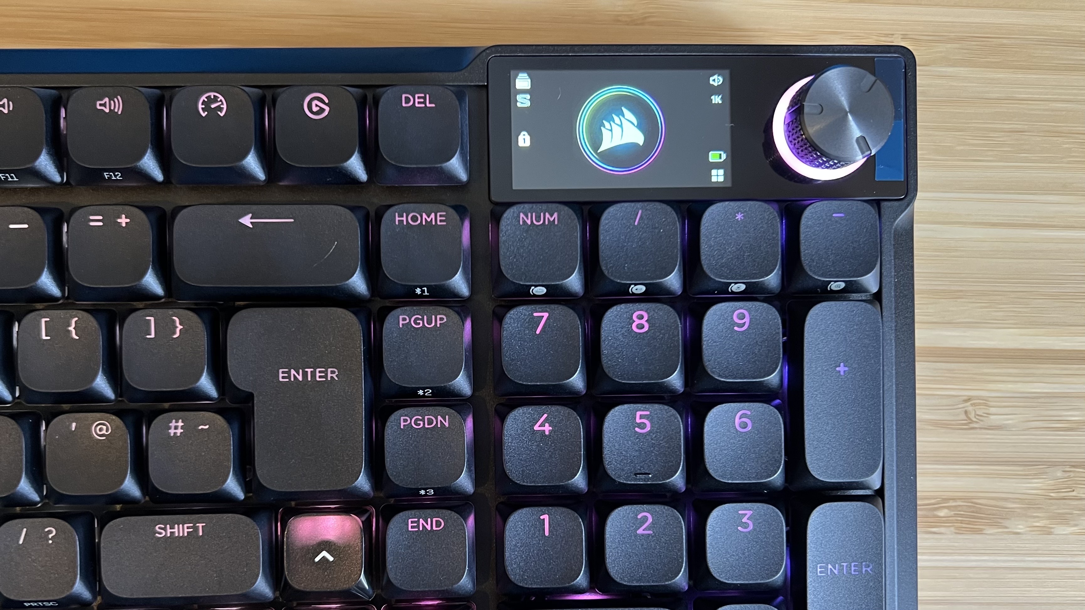 Close up on display and control dial in the top right corner of the Corsair Vanguard Air 99 Wireless gaming keyboard