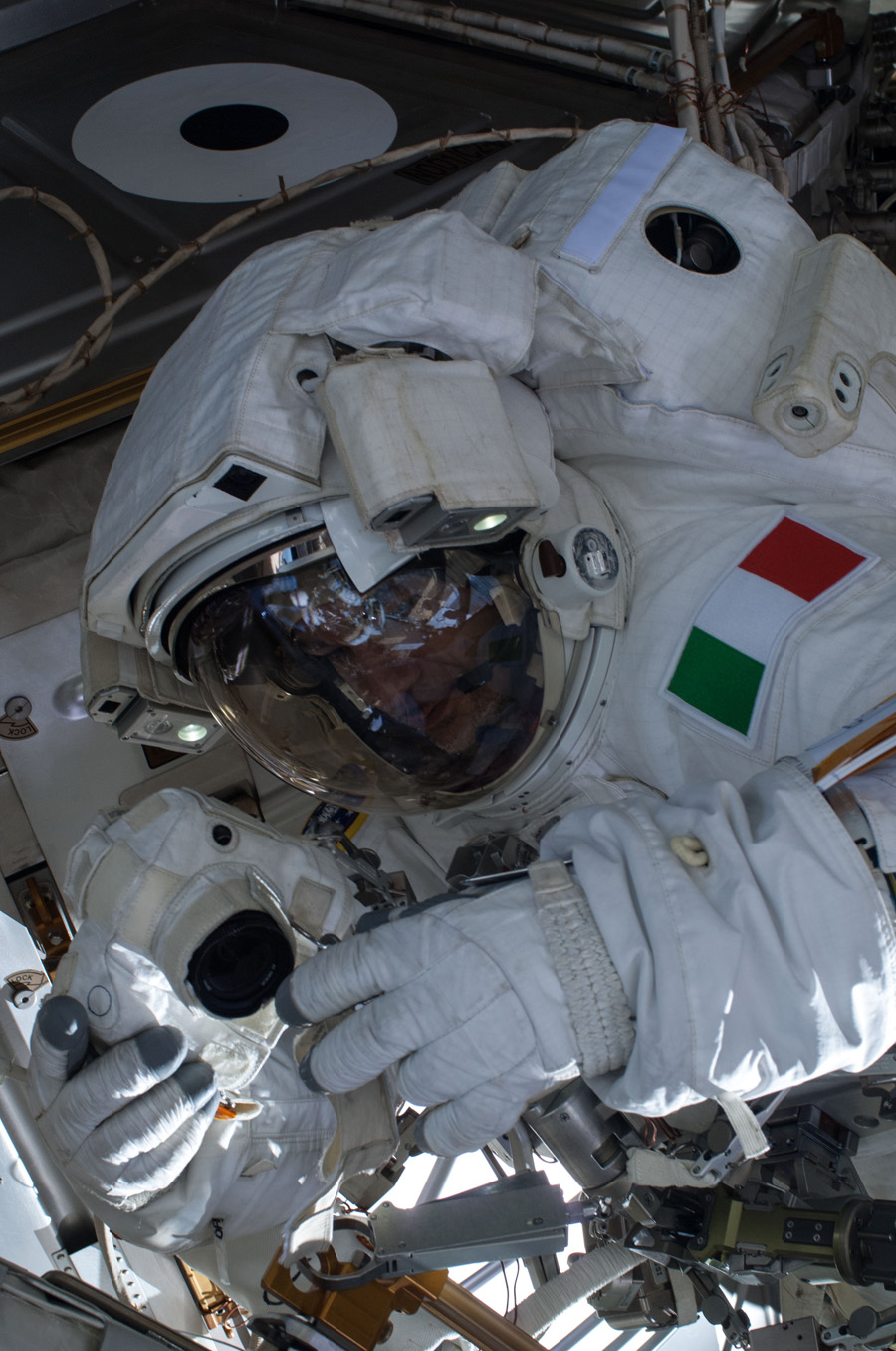 ESA astronaut Luca Parmitano works on the International Space Station in a July 16, 2013 spacewalk.  A little more than one hour into the spacewalk, Parmitano reported water floating behind his head inside his helmet.  The water was not an immediate health hazard for Parmitano, but Mission Control decided to end the spacewalk early.  This image was released July 16, 2013.