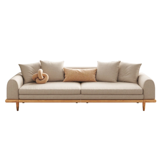 A beige sofa with low arms