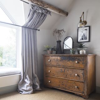 ironwork curtain rods in country bedroom