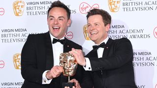 Ant and Dec holding their trophy celebrating their latest BAFTA win at the 2022 BAFTA TV Awards.