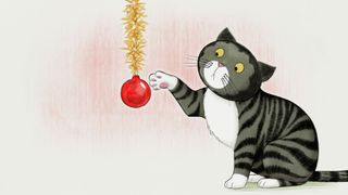 Mog plays with a bauble.