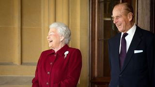 Britain's Queen Elizabeth II and Prince Philip, Duke of Edinburgh react as they bid farewell to Irish President Michael D. Higgins and his wife Sabina (not pictured) at the end of their official visit at Windsor Castle on April 11, 2014 in Windsor, United Kingdom