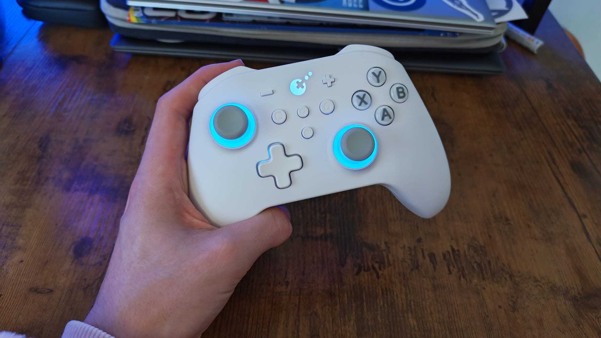 A reviewer holding the Gulikit KK3 Max