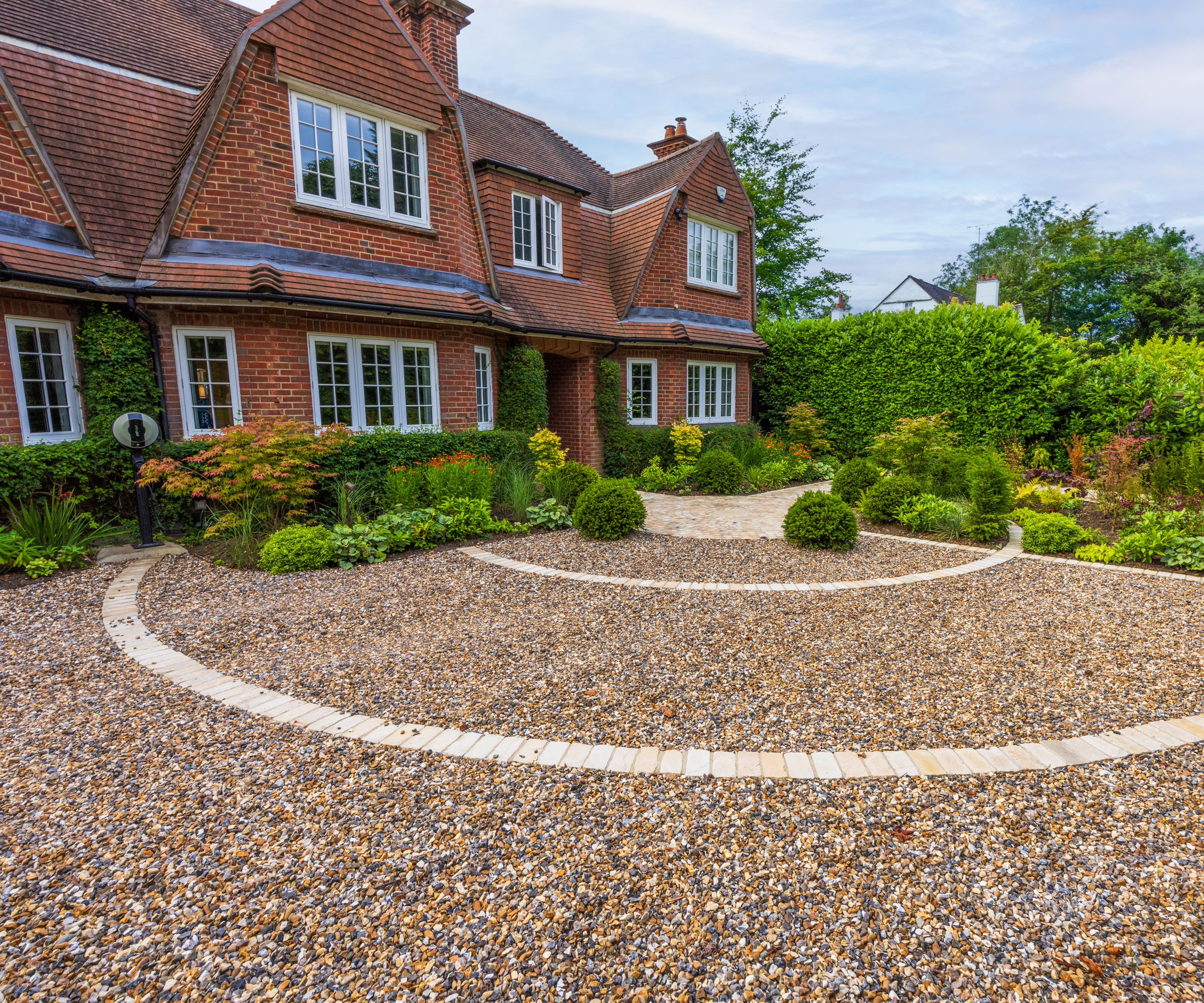 front garden design with gravel driveway and planting