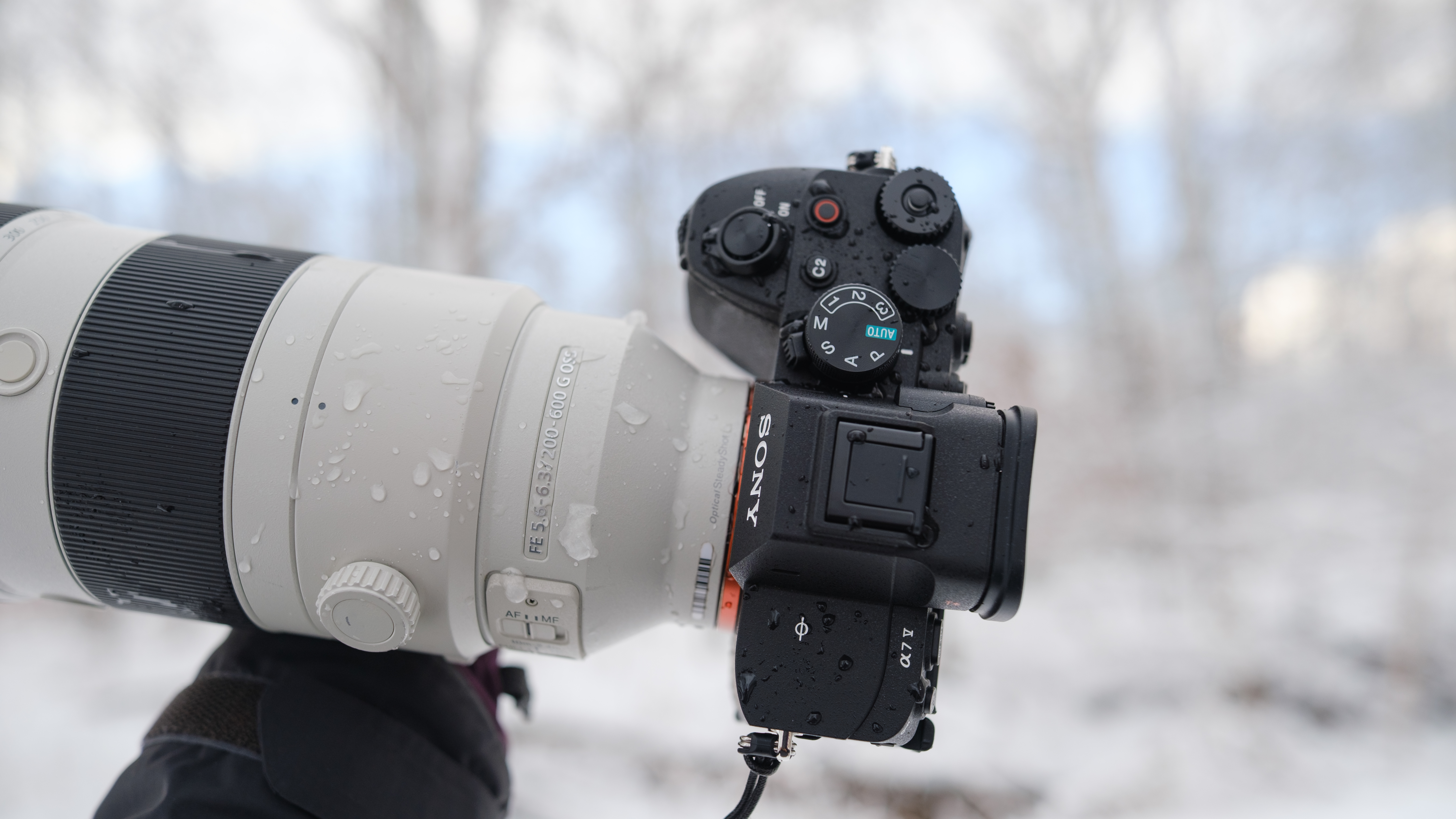 The Sony A7 V covered in snow