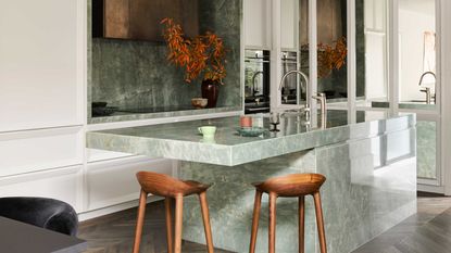 A green kitchen island made from quartzite