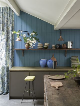 Small kitchen with sky blue tongue and groove cladding by Farrow & Ball