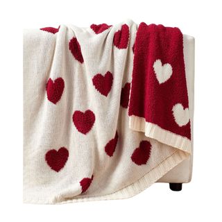 A double-sided red and white heart blanket