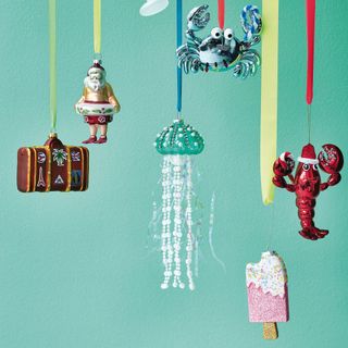 Asda Jellyfish Bauble show with other christmas baubles on a green background